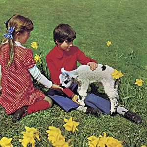 Girl and boy with spring lamb