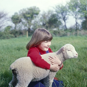 Girl with a spring lamb, West Country