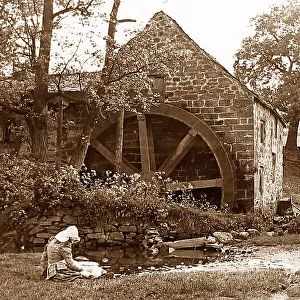 Girl by a water mill