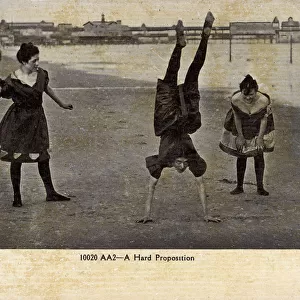 Five girls doing hand-stands on the Beach - USA