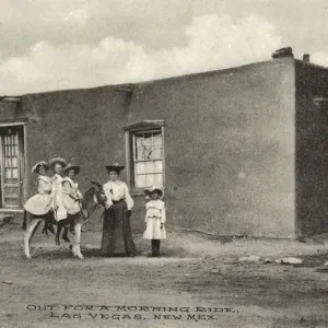 Three girls on a donkey, Las Vegas, New Mexico, USA