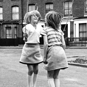 Two girls skipping on a Balham street, SW London