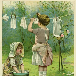 Girls Wash Dolls Clothes