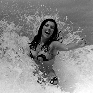 Glamour girl in the surf in Cornwall