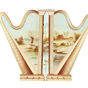 Two golden harps on a cutout greetings card