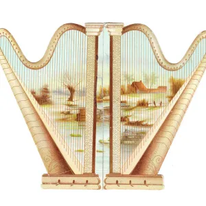 Two golden harps on a cutout greetings card