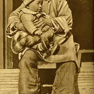 Grandmother holding her grandson, China, East Asia