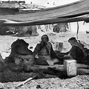 Group of Bedouins in their tent, Holy Land