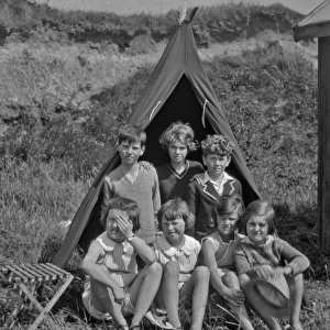Group of children camping in a field