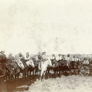 A group of cowboys in a field