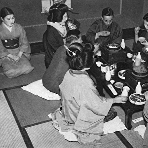 A group of Japanese people eating a meal