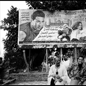 Group of men and film poster Alexandria, Egypt