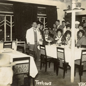 Group of people in a Yokohama teahouse, Japan