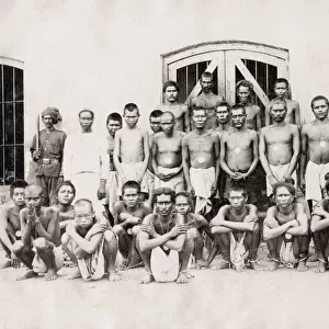 Group of prisoners in shackles, irons, India