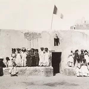 Group of women, Ouled Nail Algeria, French flag flying