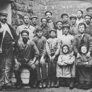 A group of working class men and boys, c. 1900. Date: c. 1900