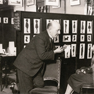 H. L. Oakley cutting a portrait in his studio
