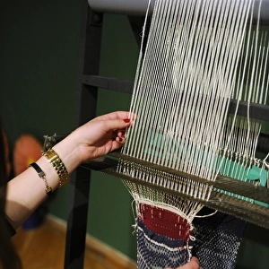 Hand loom. Woman weaving. Hungary