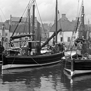Harbour scene with fishing boats and houses, Scotland