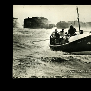 Hastings lifeboat on a rough sea, with crew on board