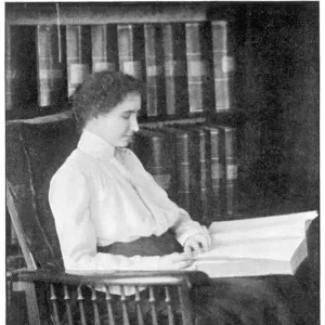 Helen Keller reading Braille