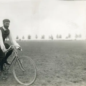 Henry Farman, 1874-1958, on the front of a tandem bicycle