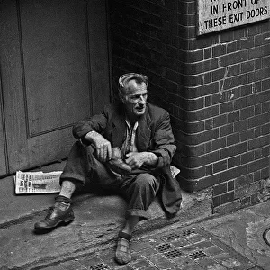 Homeless man in doorway