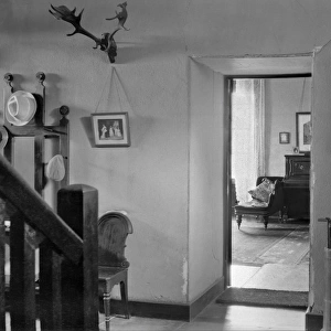 House interior with grandfather clock and antlers