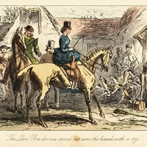 Huntsmen and women watch the fox-hounds let out of