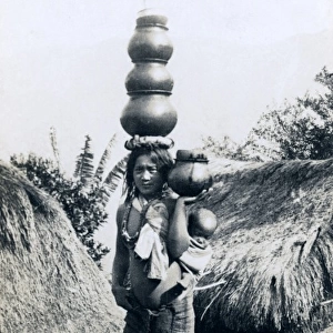 Igorote woman carring water pots and a baby