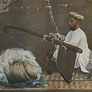 Indian man cleaning cotton