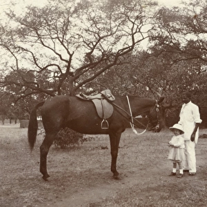 Indian man and girl with horse