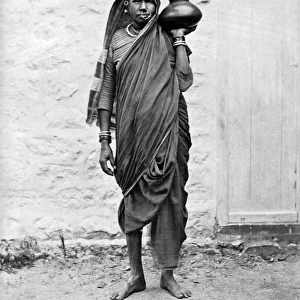 Indian woman carrying a jar