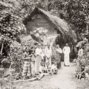Indigenous family outside home Ceylon, Sri Lanka