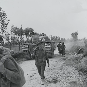 Infantry and supporting tanks advancing along the Argenta ro