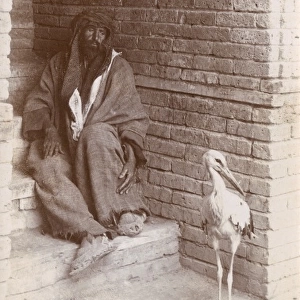 Iraq - Iraqi Man with a stork - Baghdad