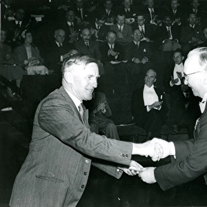 J. W. Barnes, left, is presented with his Royal Aeronauti?