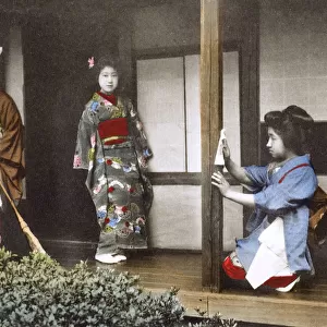 Japan - Geisha Girl - posing at home with two house staff