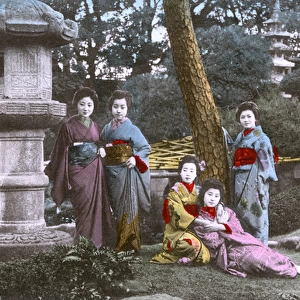 Japan - Five Geisha pose for the photographer in a garden