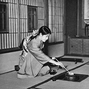 Japan - A girl making ceremonial tea