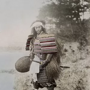 Japanese actoras a samurai, armour, two swords, grass coat