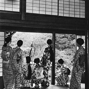 Japanese family group - different styles of kimono and hair