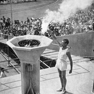 John Mark lights the Olympic bowl, opening ceremony, 1948