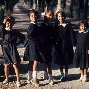 Six jolly little schoolgirls pose for the camera, Antalya