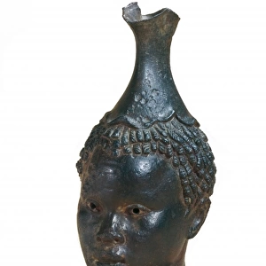 Jug shaped as black womans head. 4th-1st BC