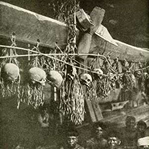Kayan men in long house with skulls, Borneo, SE Asia