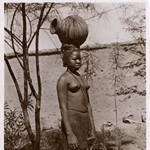 Khartoum, Sudan, Africa - Sudanese girl carrying a water pot