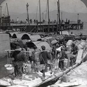 Labourers unloading a barge, Hong Kong, c. 1900 Vintage early 20th century photograph