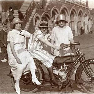 Three ladies on a 1908 Phelon & Moore motorcycle