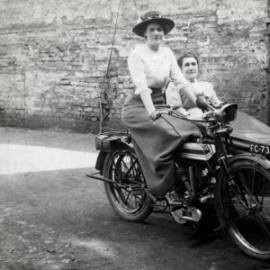 Two ladies on a 1914 Triumph motorcycle